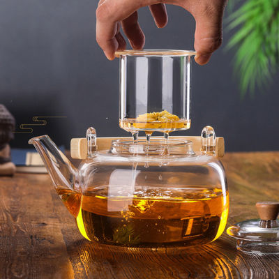 Teiera di fioritura trasparente con il filtro, tazza di tè soffiata mano messa con il bollitore fornitore