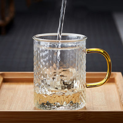 Insiemi della tazza di Infuser del tè di vetro di Pyrex della prova di calore con il mestiere soffiato mano del coperchio fornitore