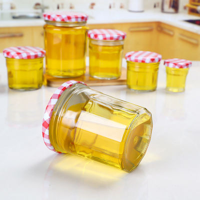 Vuoto di vetro del barattolo dell'inceppamento di progettazione del cliente per a forma di rotondo del coperchio della vite del miele fornitore